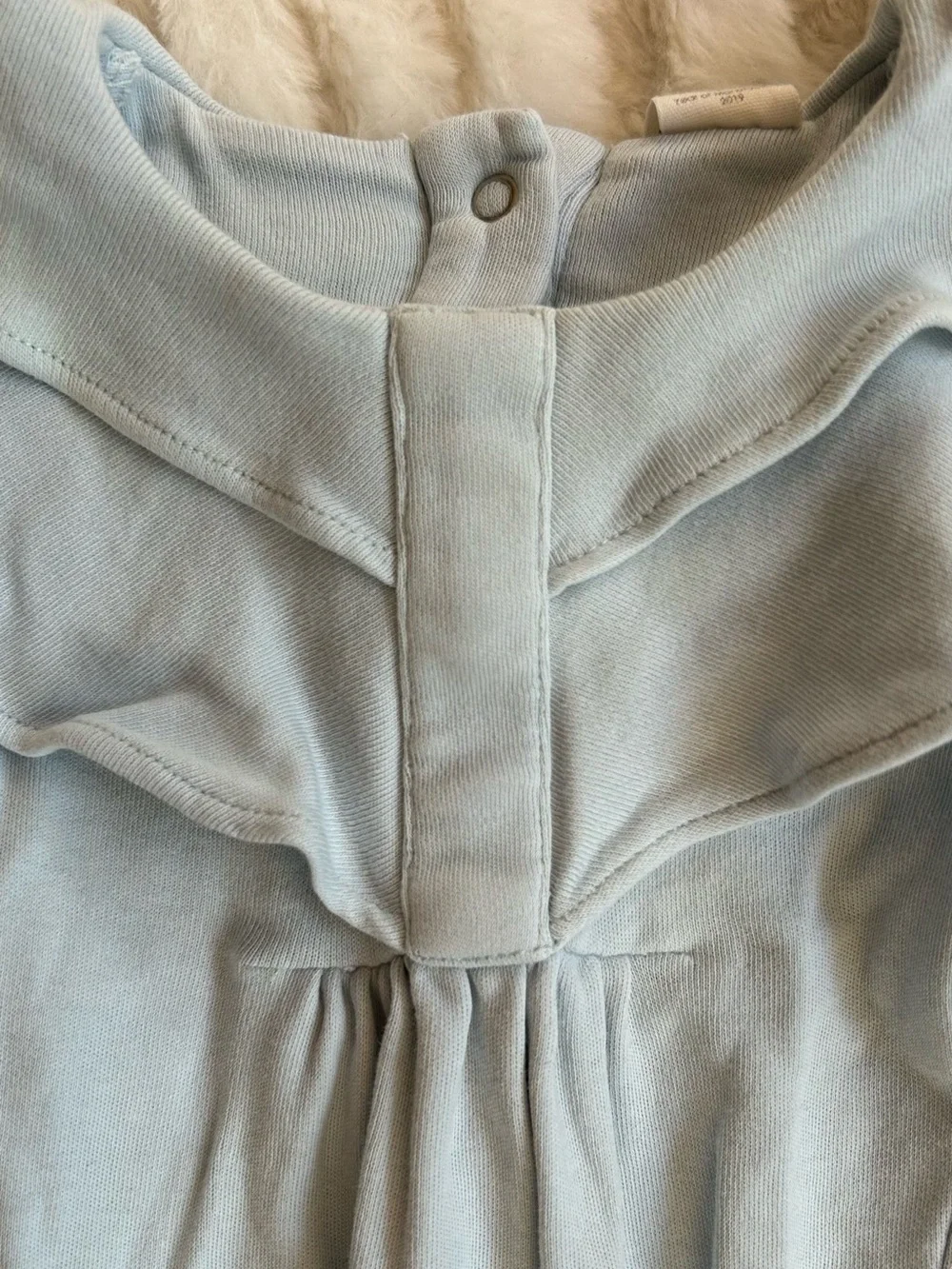 Kate Quinn Cotton Ruffle Neck Footie